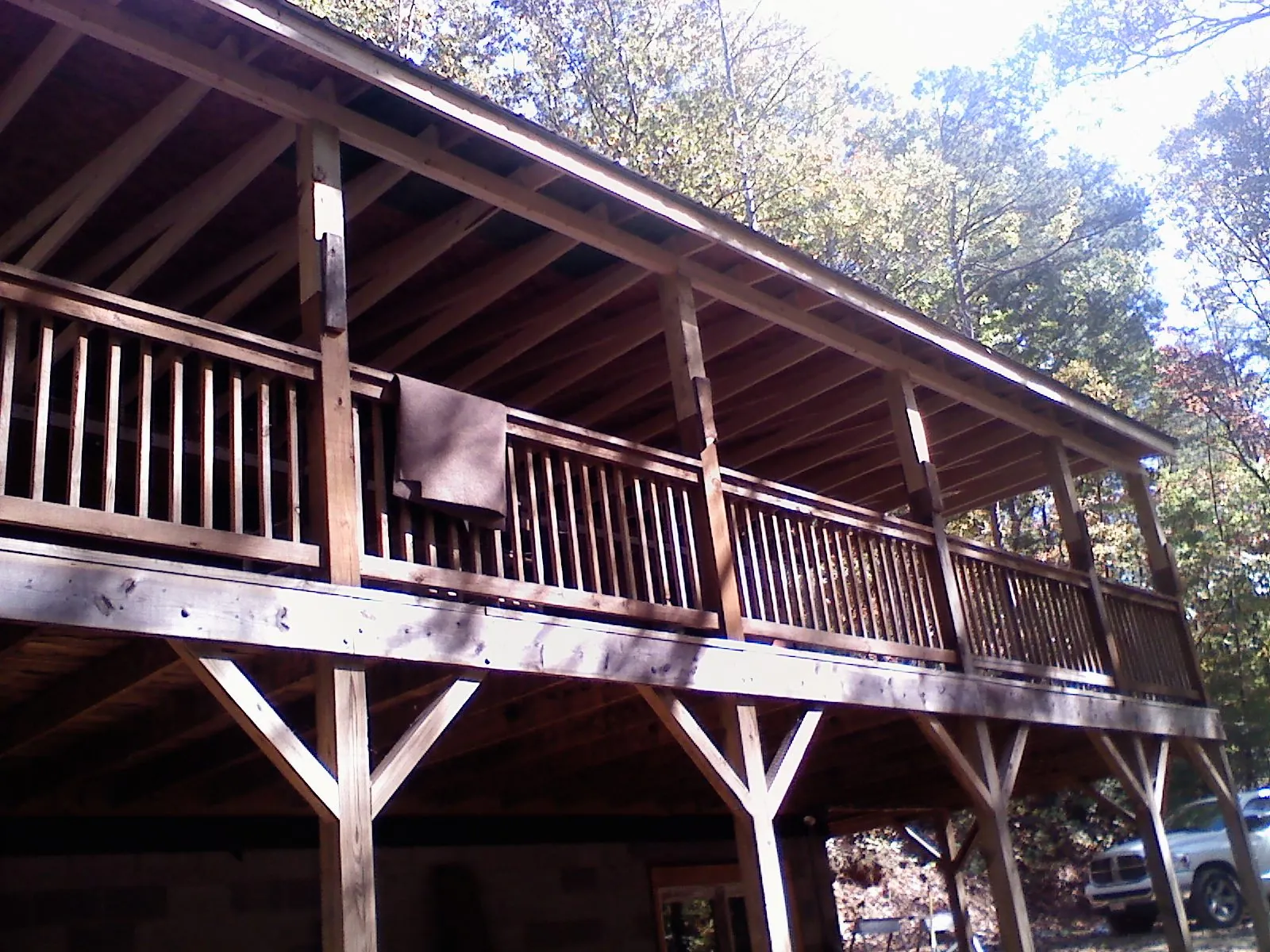 Timber framing under a new elevated porch and deck — Roof Leak Repair in Petoskey by Roofing Brothers